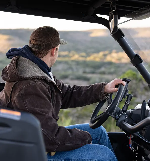 man driving outdoor vehicle